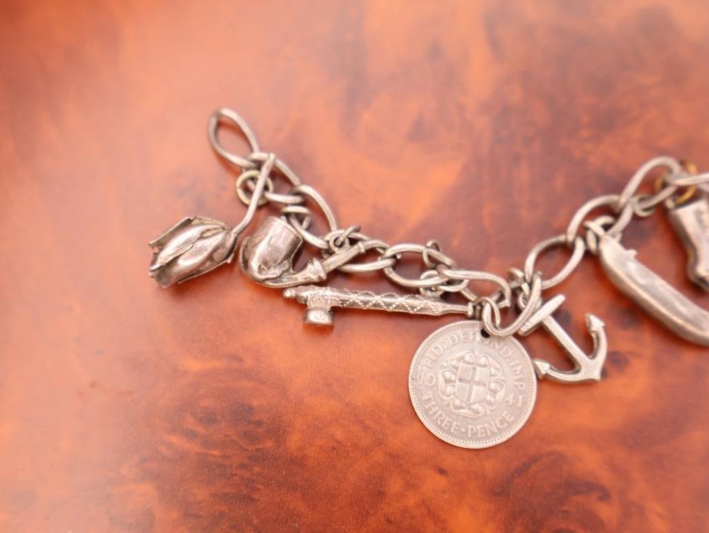 Vintage silver charm bracelet with assorted charms - 7