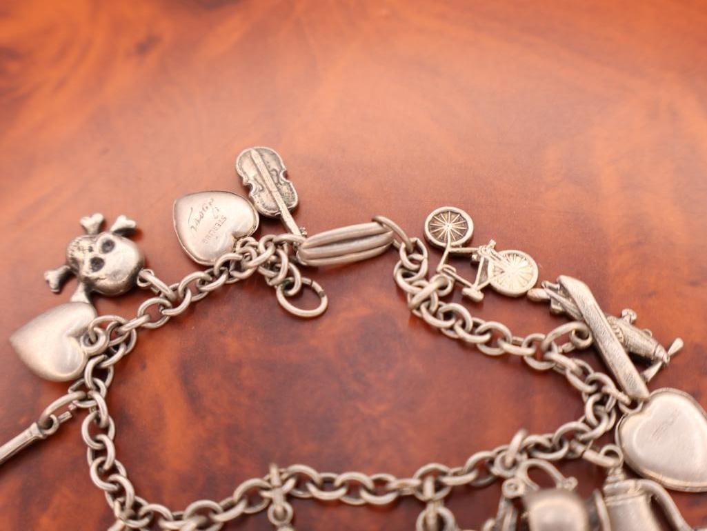 Vintage sterling silver charm bracelet with assorted charms - 6
