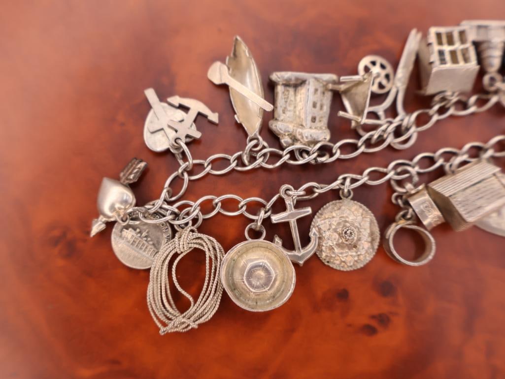 Vintage silver charm bracelet with assorted charms - 6