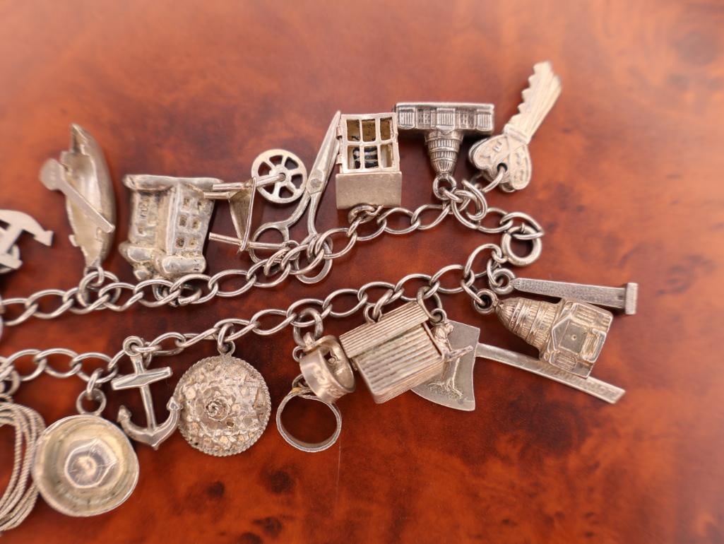 Vintage silver charm bracelet with assorted charms - 7