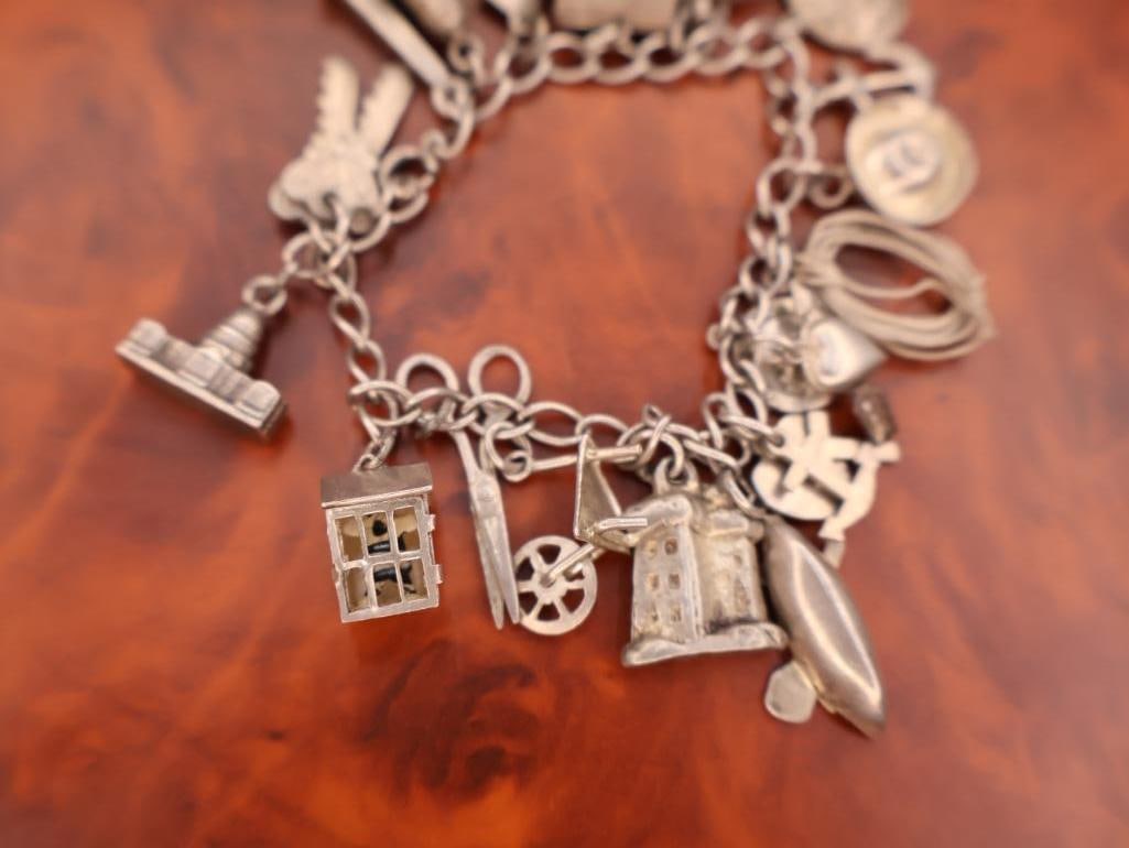 Vintage silver charm bracelet with assorted charms - 8