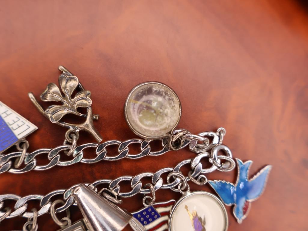 Vintage sterling silver charm bracelet with numerous charms - 5