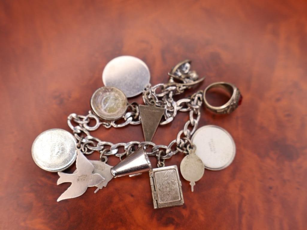 Vintage sterling silver charm bracelet with numerous charms - 6