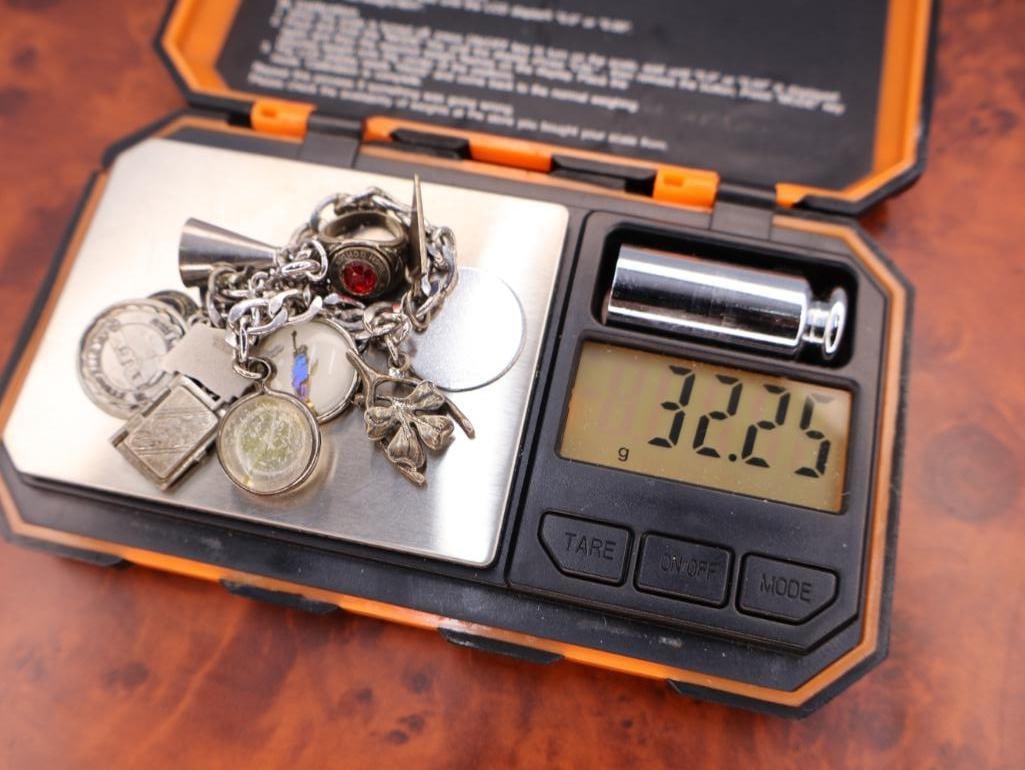 Vintage sterling silver charm bracelet with numerous charms - 8