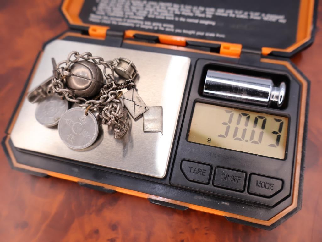 Vintage sterling silver charm bracelet with multiple charms - 10