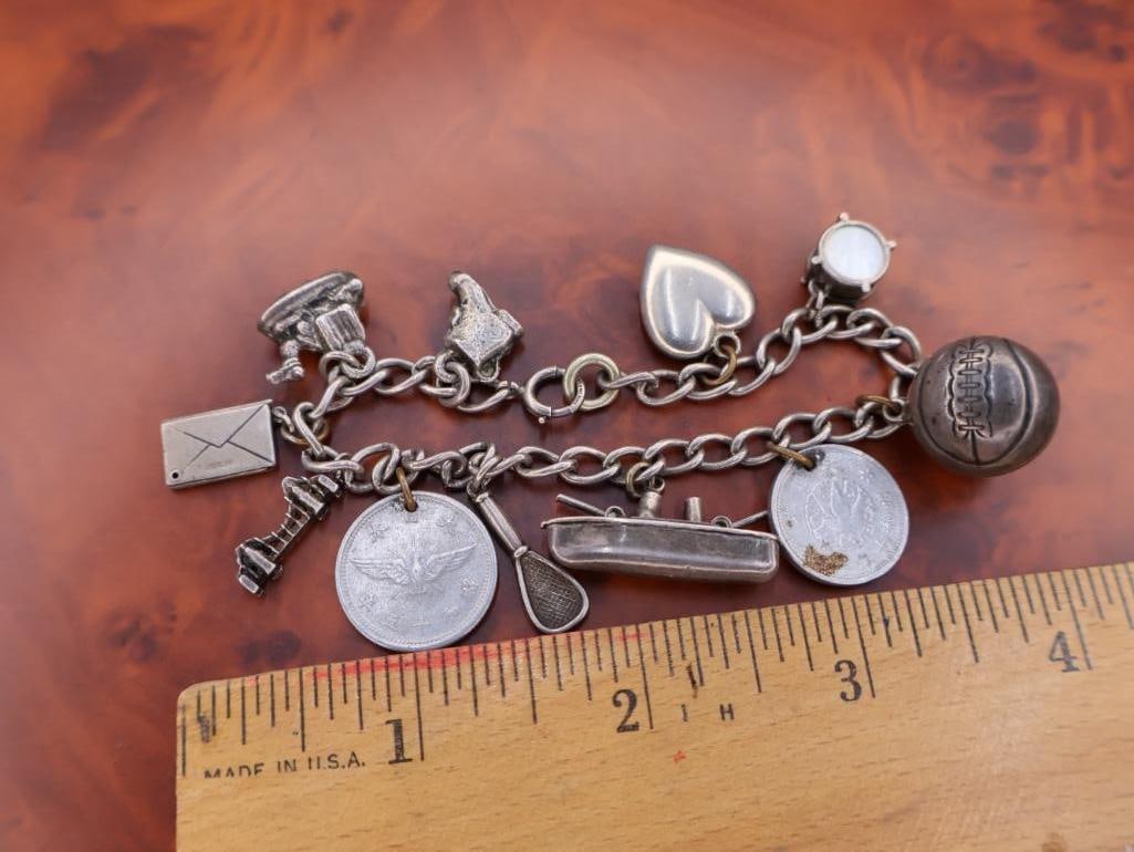 Vintage sterling silver charm bracelet with multiple charms - 2