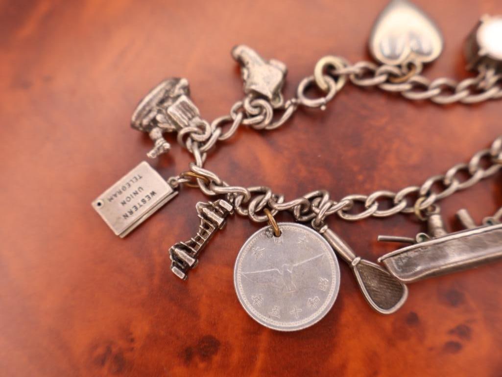Vintage sterling silver charm bracelet with multiple charms - 3