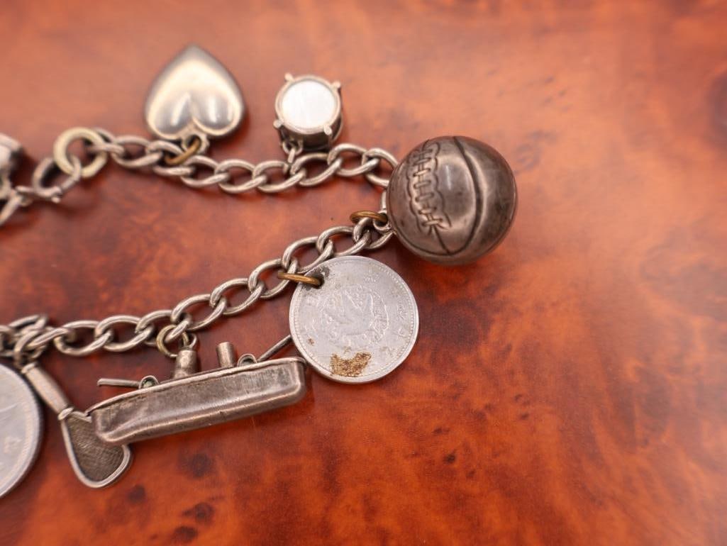 Vintage sterling silver charm bracelet with multiple charms - 4