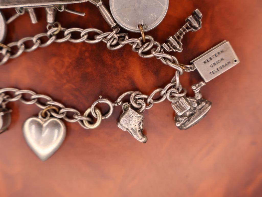Vintage sterling silver charm bracelet with multiple charms - 5