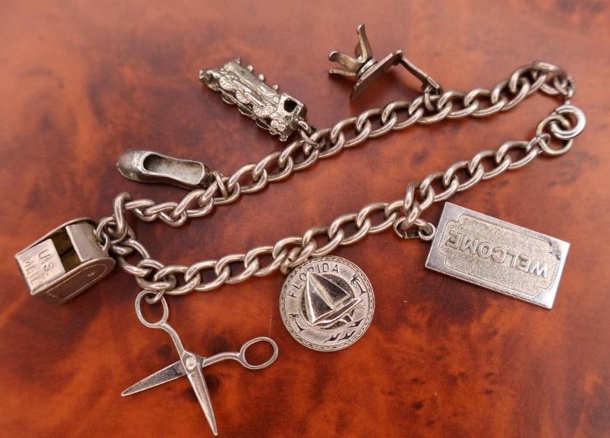 Vintage silver charm bracelet with assorted charms (1 of 7)