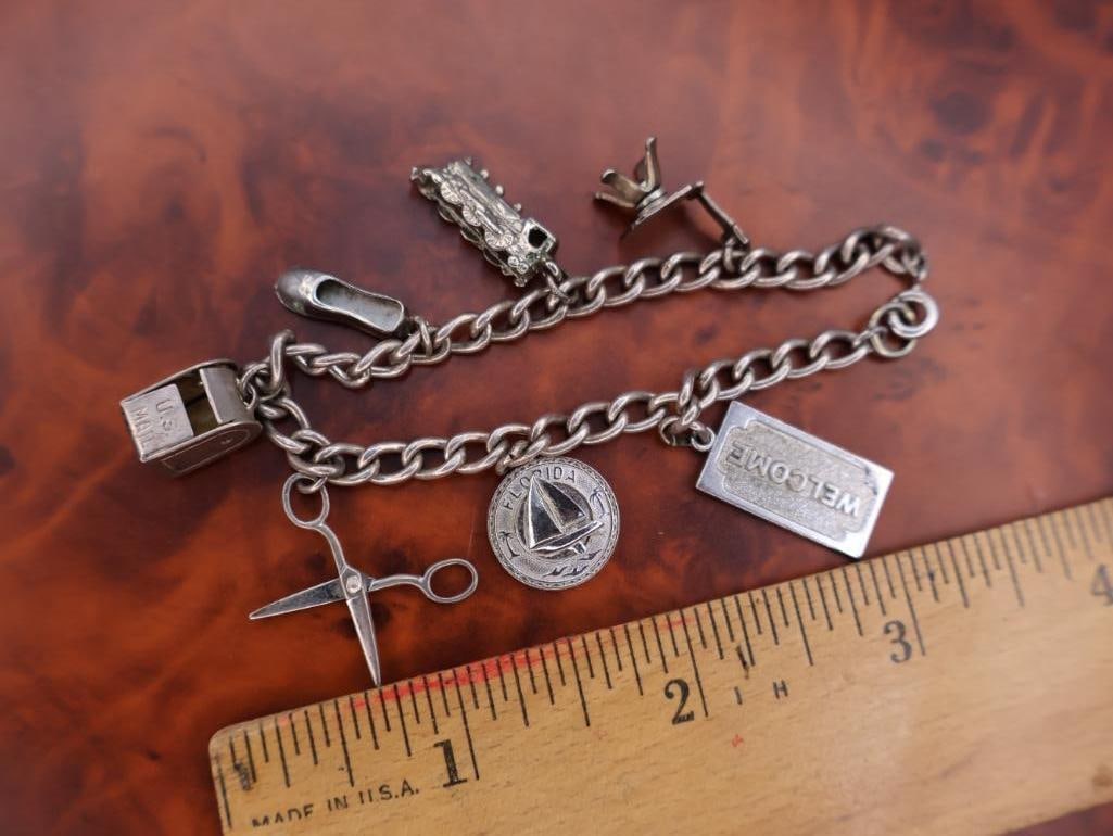 Vintage silver charm bracelet with assorted charms - 2