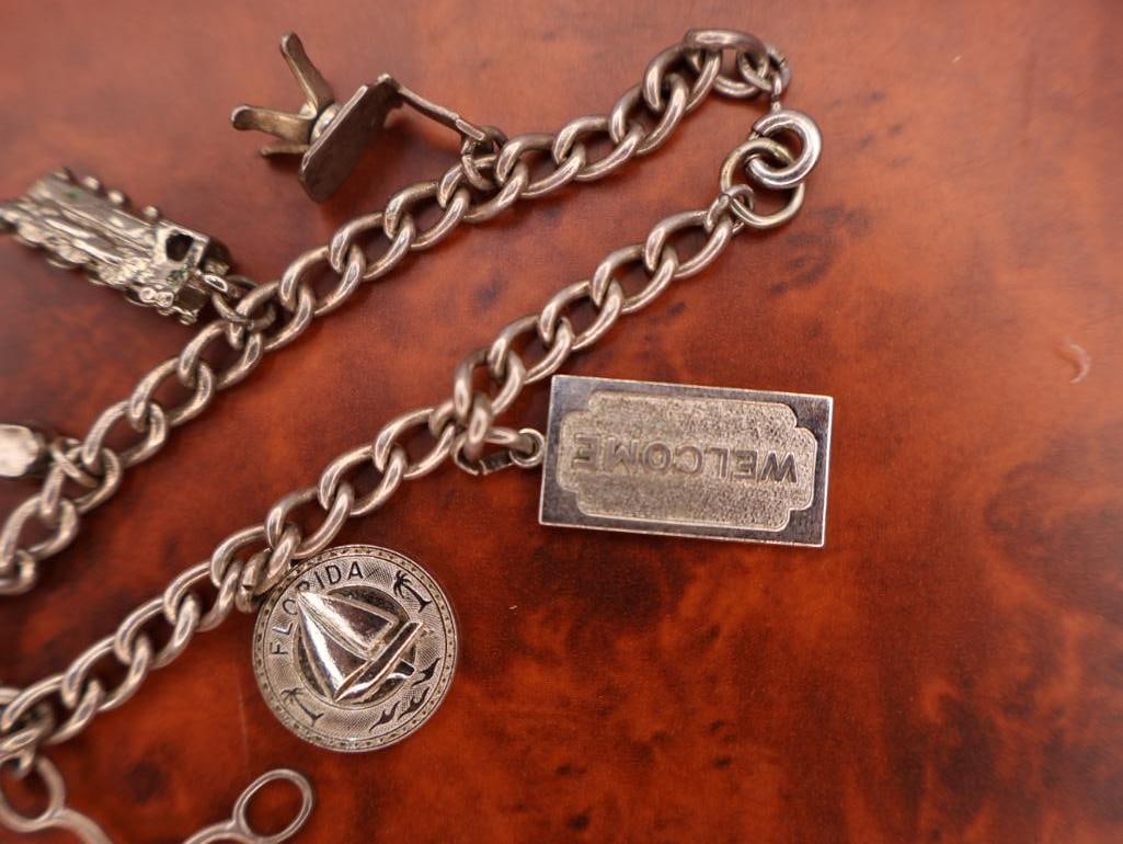 Vintage silver charm bracelet with assorted charms - 4