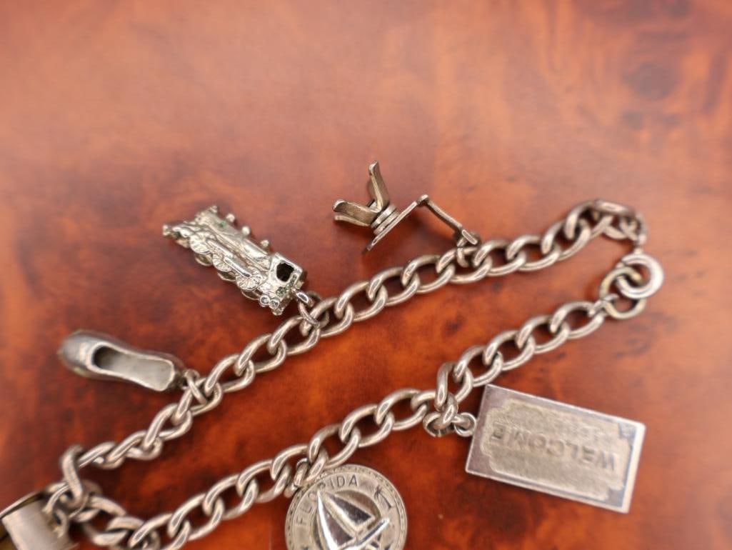 Vintage silver charm bracelet with assorted charms - 5
