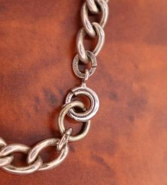 Vintage silver charm bracelet with assorted charms - 6