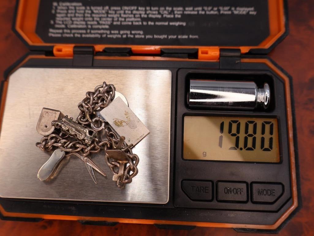 Vintage silver charm bracelet with assorted charms - 7