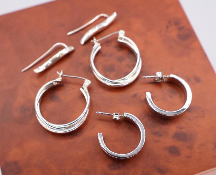 Three pairs of sterling earrings: Click on the main photo to view more photos of this lot.