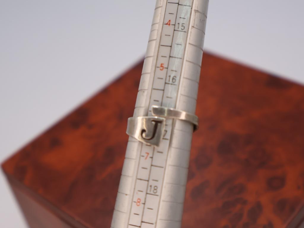 Silver spinner ring and an adjustable initial ring - 7