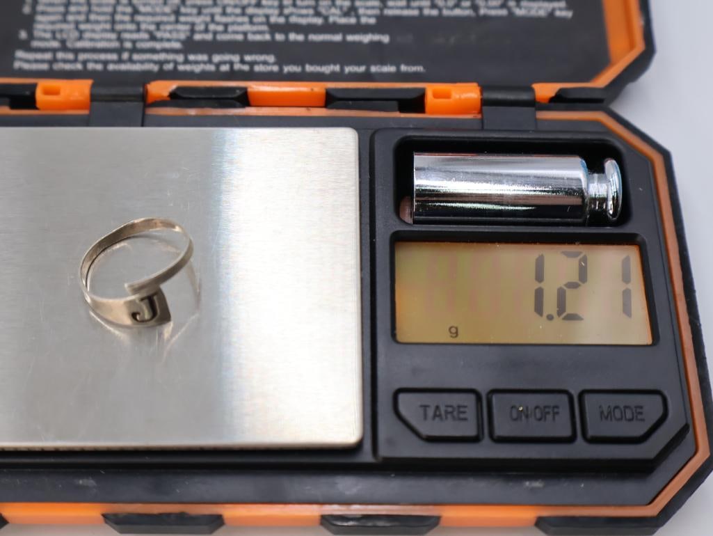 Silver spinner ring and an adjustable initial ring - 9