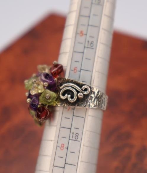 These are sterling silver rings with semi-precious stones - 11
