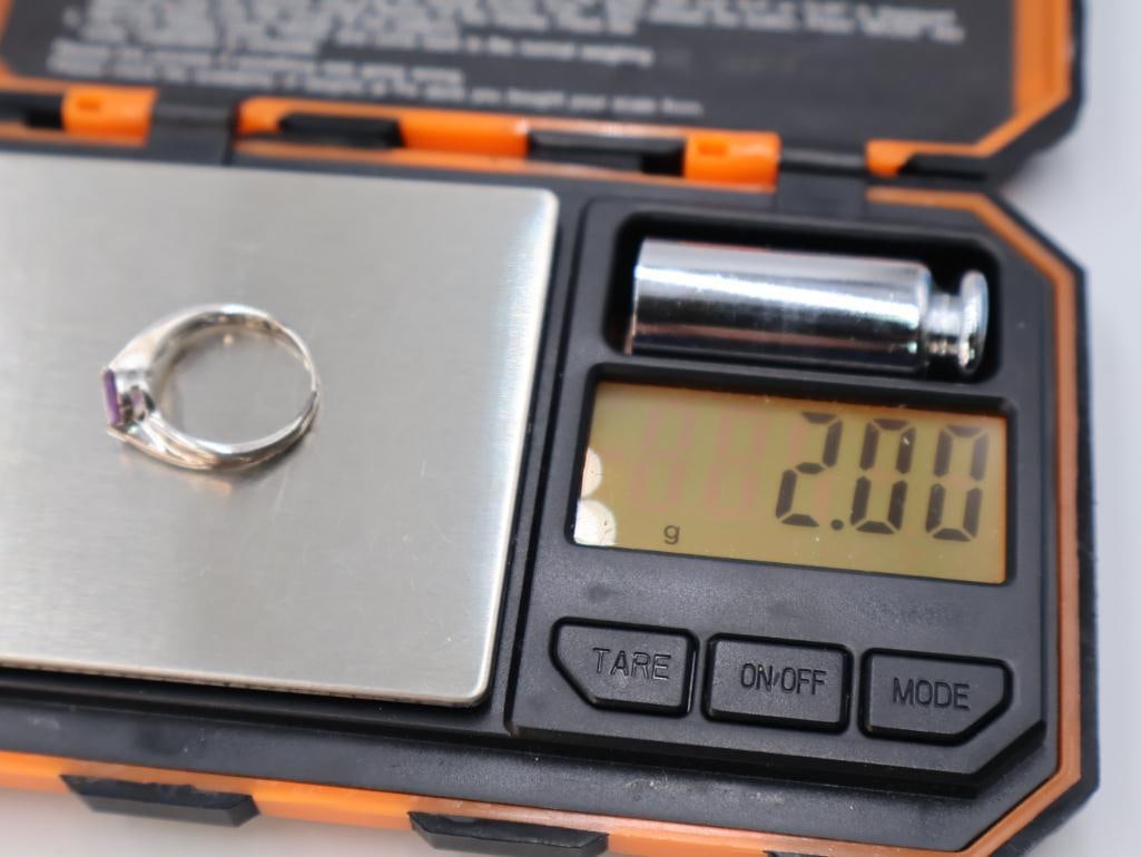 These are sterling silver rings with semi-precious stones - 7