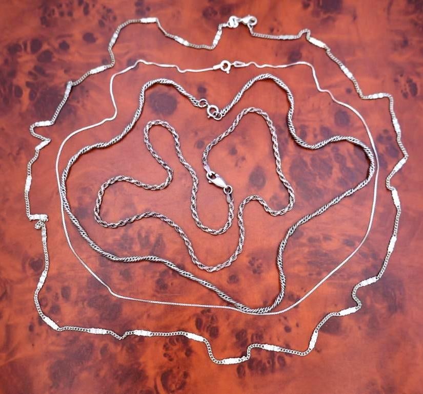 Four silver chains: Marked 925, sterling silver. Click on the main photo to view more photos of this lot. 