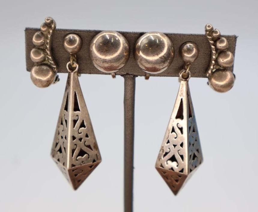 Vintage Mexican Taxco sterling silver Earrings: The large pair is vintage Mexican Taxco sterling silver cutout earrings with smooth half-ball surmounts and diamond-shaped hollow dangles featuring scrolling cutouts. Click on the main photo to view