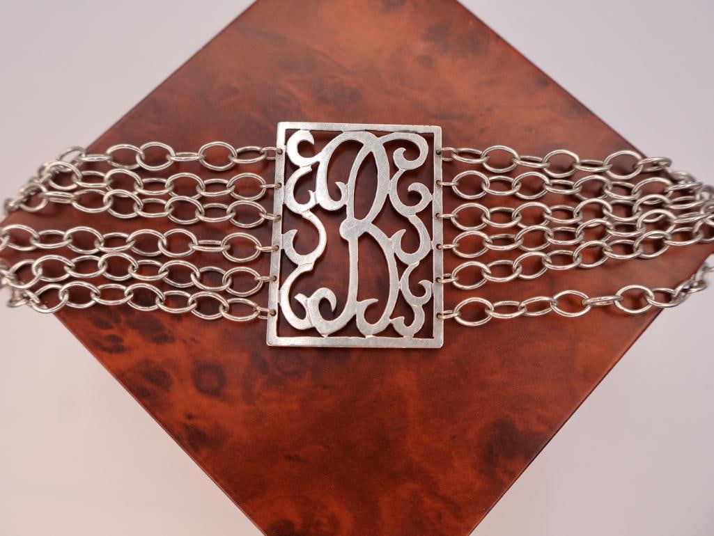 Jane Basch sterling silver scroll panel link bracelet: This is a Jane Basch sterling silver scroll panel link bracelet with a toggle clasp. Click on the main photo to view more photos of this lot. Weight and length can be viewed in the photos. 