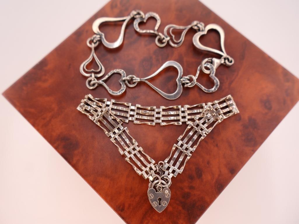 Two Beautiful sterling ladies Bracelets: Vintage sterling silver five-bar gate bracelet with a heart-shaped padlock clasp and safety chain. a Silpada "Spread the Love" B1701 sterling silver heart link bracelet. 