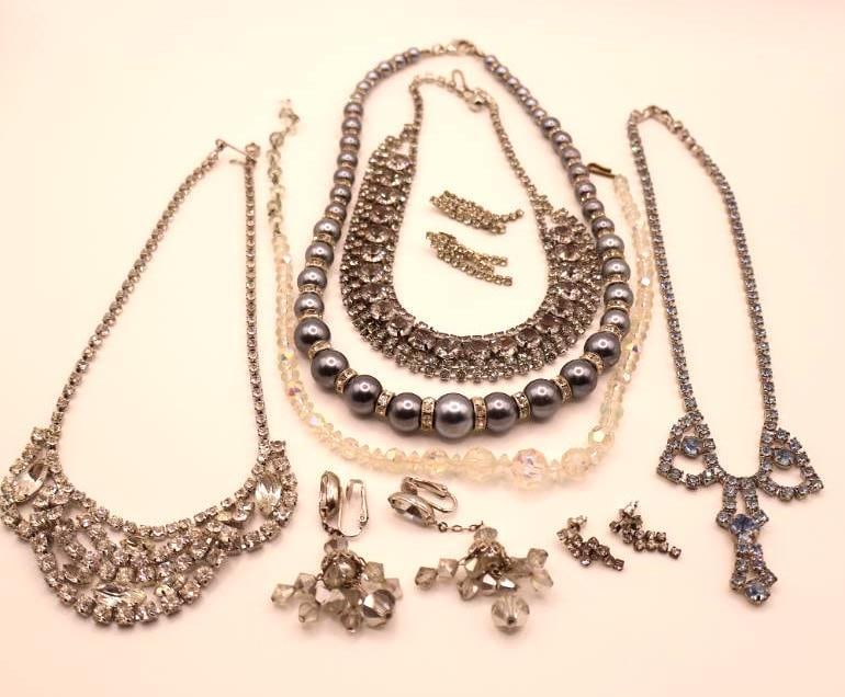Collection of Vintage Rhinestone Jewelry: Lovely rhinestone heavy vintage necklaces, one with blue tones, earrings, and faux blue pearl necklace 