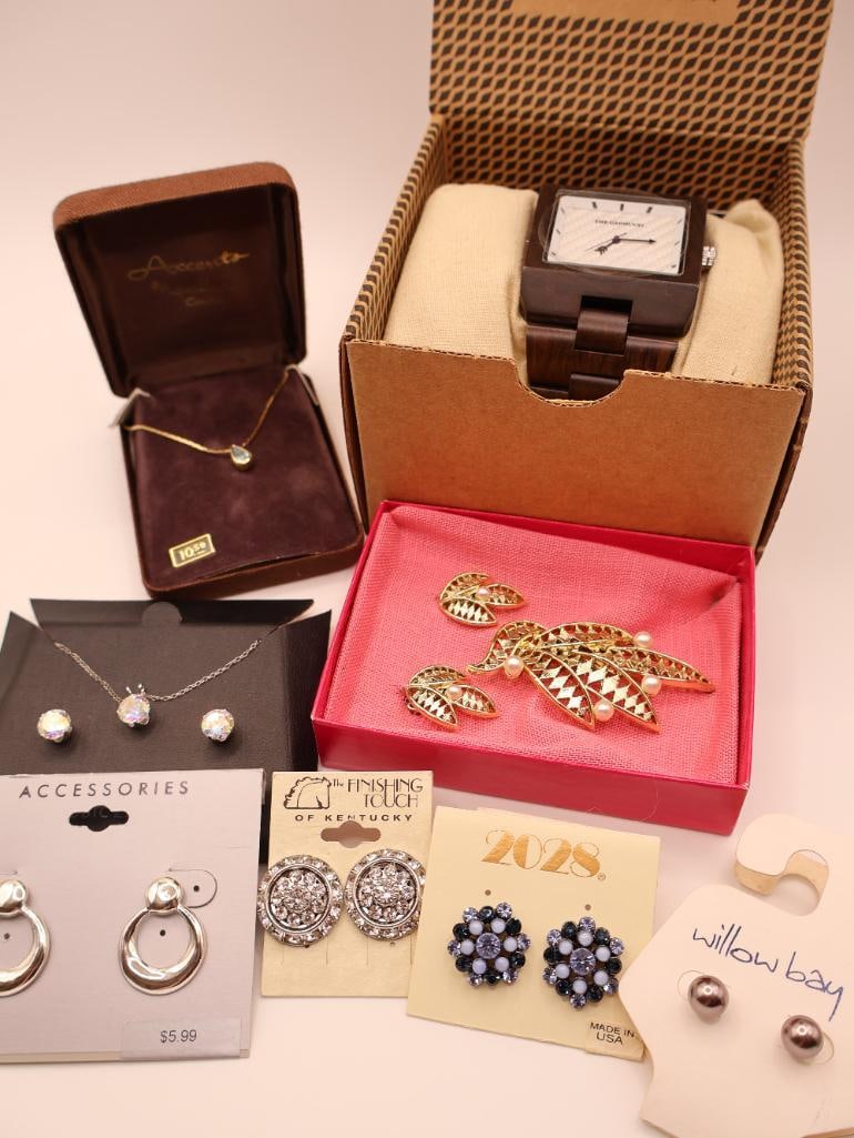 Collection of Jewelry including Garwood Watch and Sterling CZ Necklace: The Garwood 'Domino' wood men's watch with original packaging, earrings, sterling chain cubic zirconia necklace and earring set, vintage clip earrings and pin set, and petite blue stone necklace 