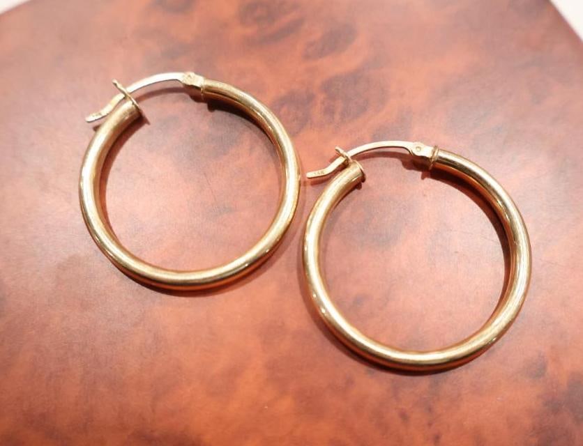 Pair of 14K Gold Hoop Earrings: Earrings marked 14k, weighs 4.23 grams 