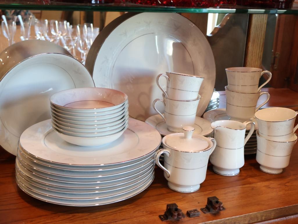 International Fine China Set: This design was produced in Japan and is characterized by its delicate, silver-toned floral and leaf motifs on a crisp white porcelain base with platinum trim. Click on the main photo to view more pho