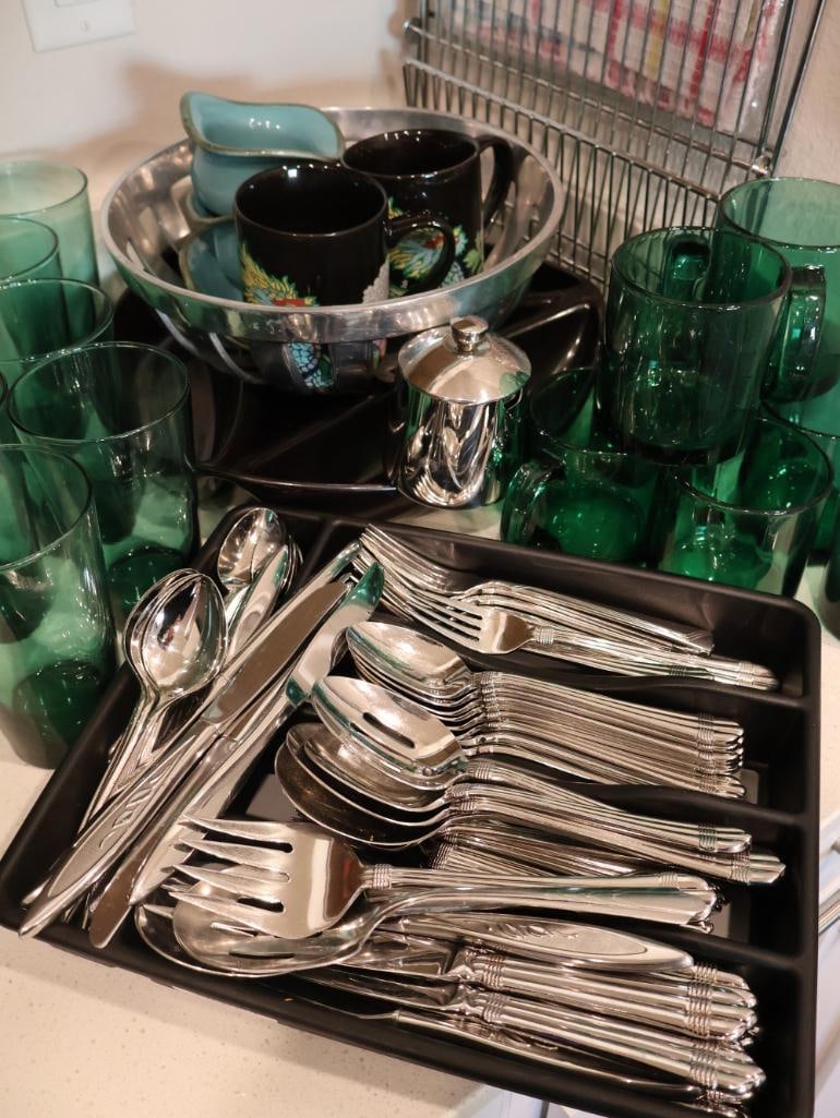 Mix of vintage mid-century glassware, designer flatware, and decorative serving pieces: Large service of International Silver "Forte" stainless steel flatware, decorative black dragon mugs, a large, deep silver-plated serving bowl, and more. 
