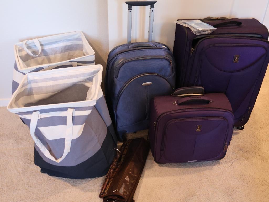 Luggage Collection and Laundry Hampers: Matching two-piece set is from Travelpro, blue Rolling Suitcase Samsonite, two soft laundry hampers, and one travel jewelry storage. 