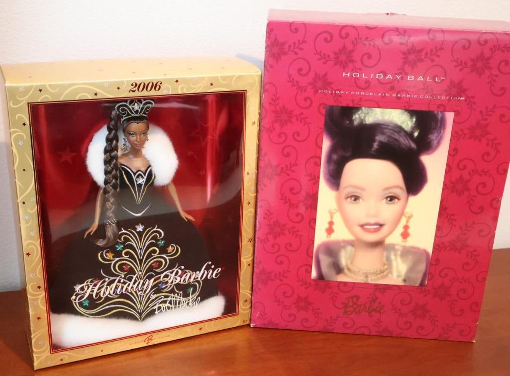 Two highly collectible Holiday Barbie dolls: The 2006 Holiday Barbie by Bob Mackie and the 1997 Holiday Ball Barbie from the Holiday Porcelain Collection. 