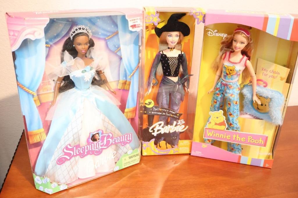 Three Novelty Barbie Dolls: Sleeping Beauty, Halloween Witch Barbie, and Winnie the Pooh 