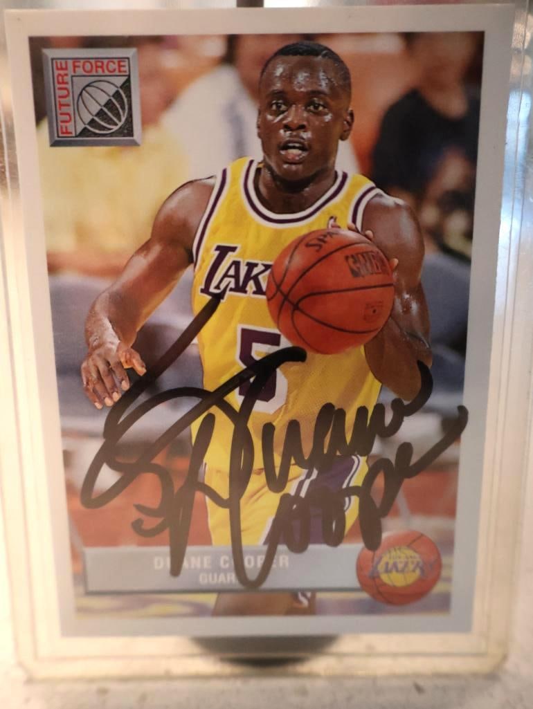 Autographed 1992-93 Future Force Duane Cooper rookie card #5: Set: 1992-93 Future Force Basketball. Player: Duane Cooper, shown in his #5 Los Angeles Lakers home jersey. Signature: The card features a prominent bold hand-signed autograph in black ink across the
