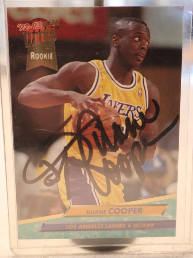 Hand-signed 1992-93 Fleer Ultra Duane Cooper rookie card #286: Set: 1992-93 Fleer Ultra Basketball. Player: Duane Cooper, depicted in his Los Angeles Lakers home jersey. Status: Designated as a "ROOKIE" card, as shown by the gold foil stamping on the front.