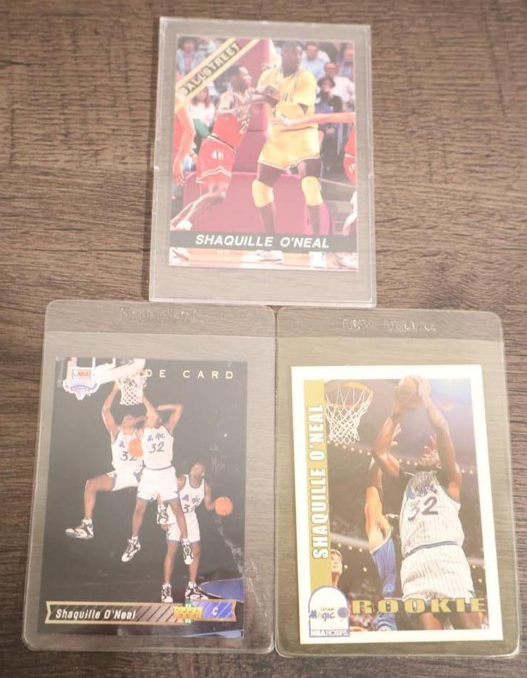 Three prominent Shaquille O'Neal rookie cards from the 1992-93 NBA season (1 of 8)