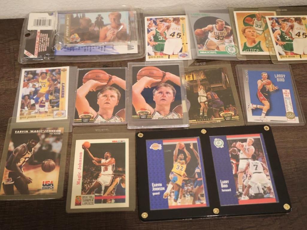 This collection primarily features Larry Bird and Magic Johnson trading cards from the early 1990s (1 of 11)