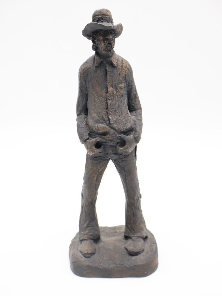 Vintage Michael Garman Western Statue 'Texan': 10" tall fine cement casted statue by Michael Garman, named 'Texan' and made to simulate bronze. Includes original pamphlet