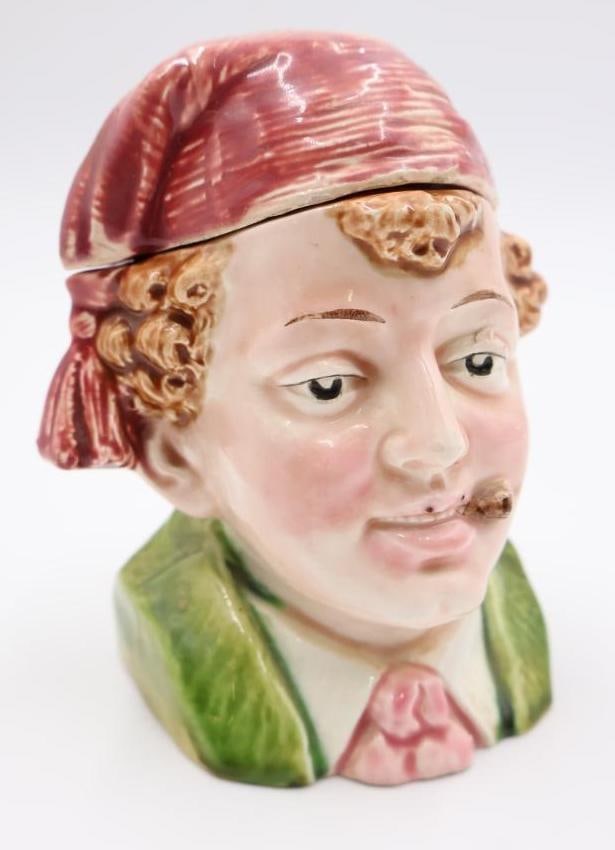 Antique Majolica Tobacco Jar: Most likely German or Austrian made, featuring smoking fellow in a cap this antique jar was made to hold tobacco