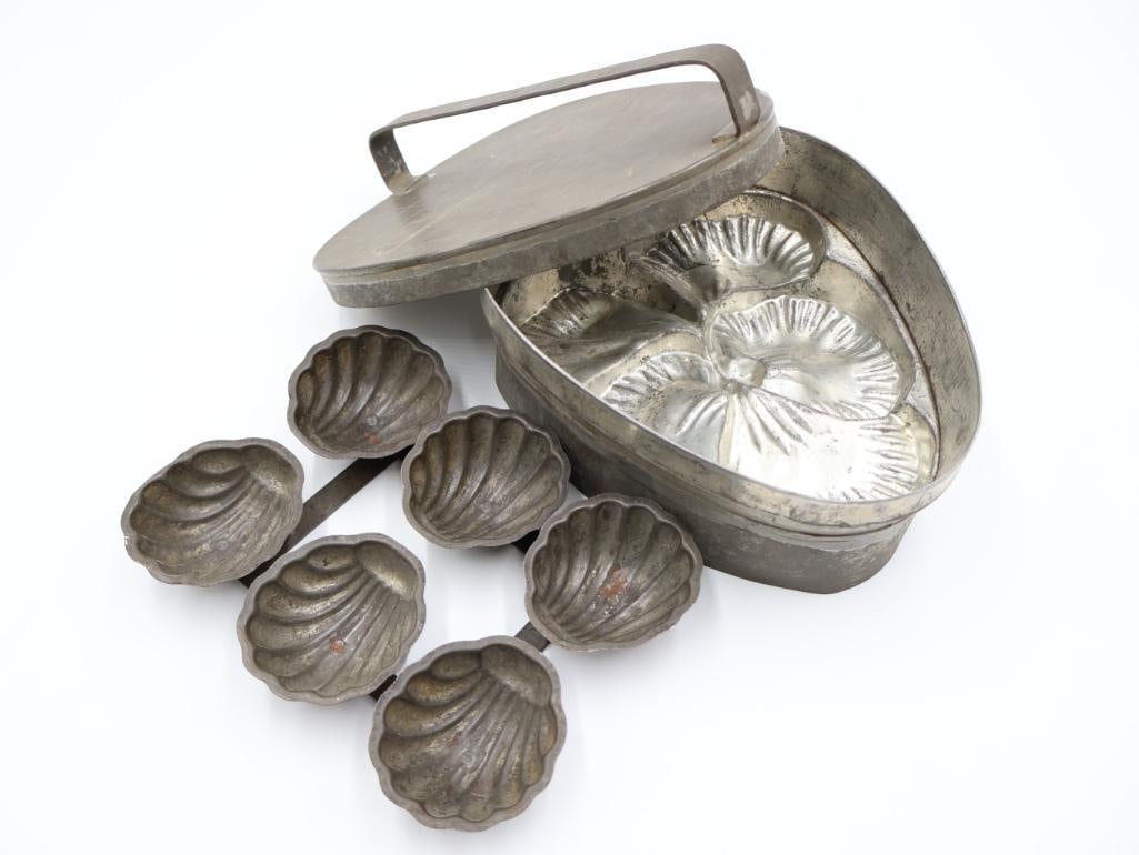 Early 1900's Seashell and Flower Baking Molds: Six seashell antique mold, commonly used for ice cream or other desserts. Larger lidded pan mold with pansy flower design used more for breads or pastries, marked made in France with maker mark