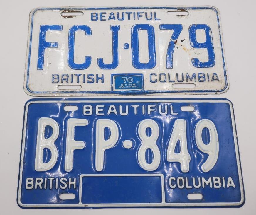 Two Vintage British Columbia License Plates: Blue on white, and white on blue design 