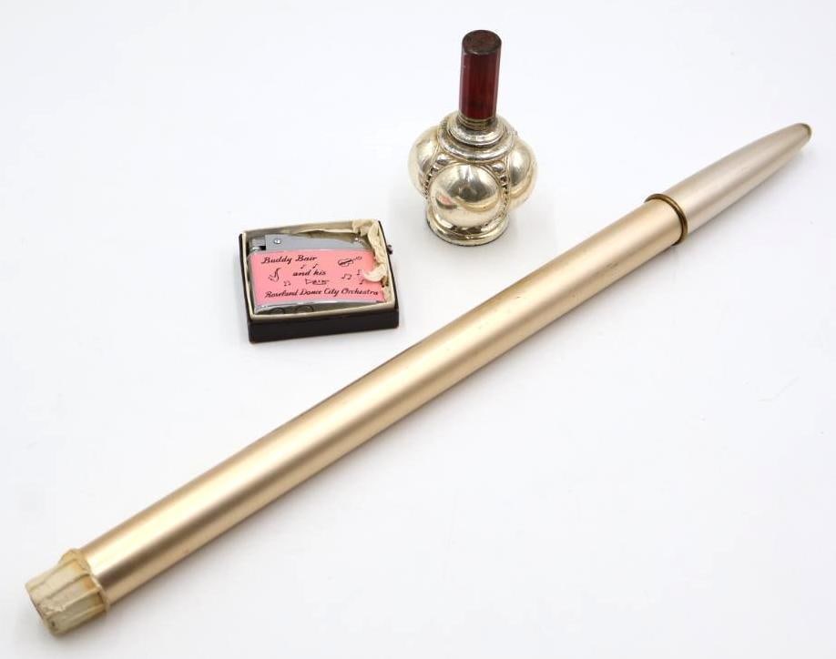 Two Lighters and Refillable Candlestick: Ronson 4 hour refillable candlestick with adjustable flame, pink lighter marked 'Buddy Bair and his Roseland Dance City Orchestra', and vintage metal lighter with red top 
