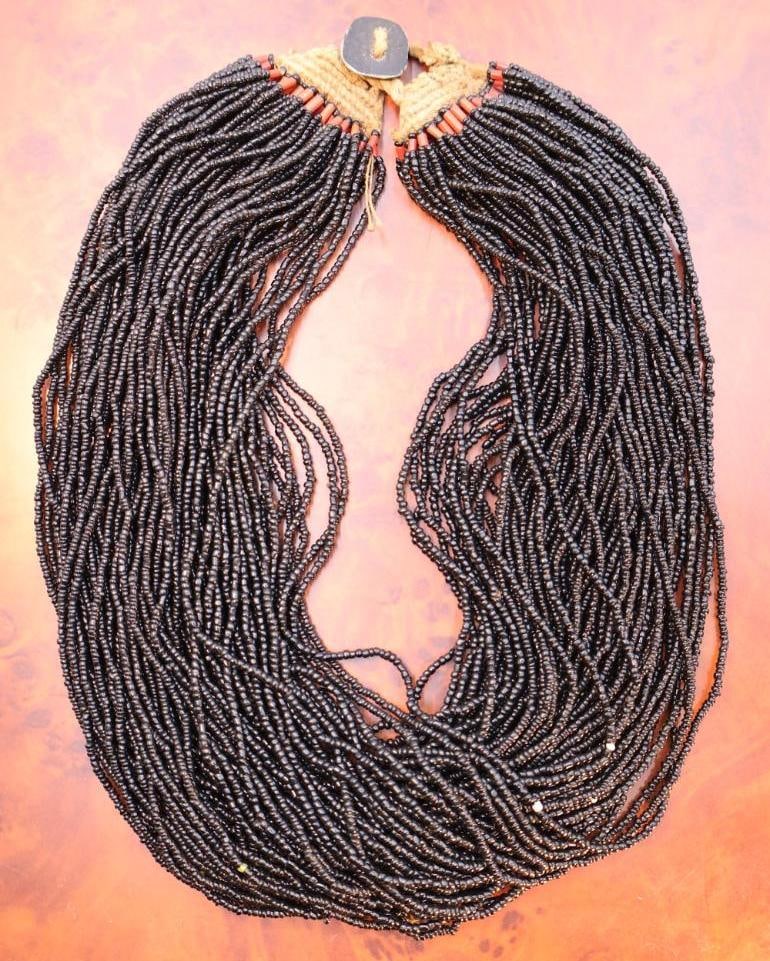 Vintage Naga Multi-Strand Black Glass Bead Necklace: "The people of Nagaland, in Northern India, were the last living headhunters, a group with deep and simple principles of justice and decoration. Along with the ban of headhunting in the 1960s, many of