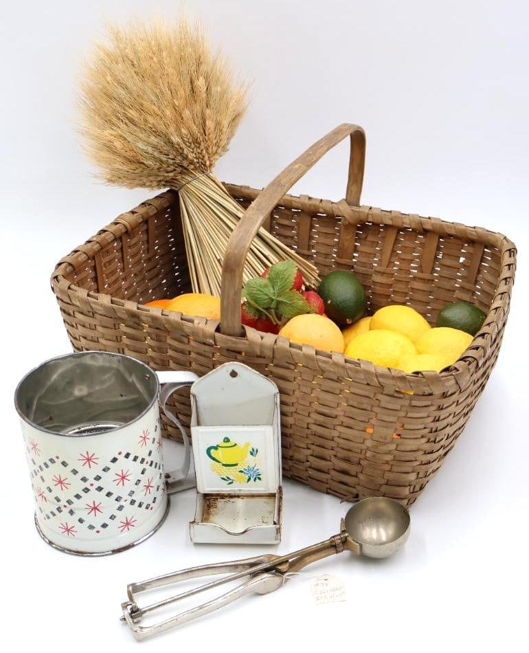 Antique Basket and Vintage Kitchen Items: Antique woven basket with bent wood hand in good shape with wheat bushel and fake fruit including ceramic lemons. Gilchrist Ice Cream Scoop, Teapot designed match holder, and Androck USA shifter