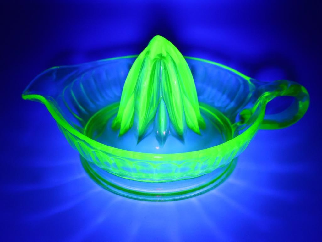 Vintage Uranium Green Glass Juicer: Black light sensitive green glass juicer with single handle, measures about 7" long