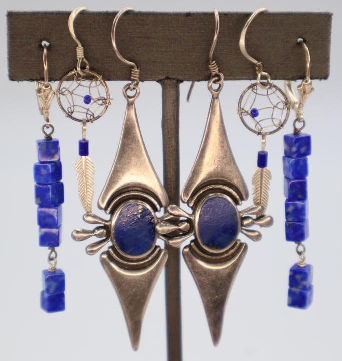Three Pairs of Blue Stone Adorned Earrings: Large ornate dangle earrings marked 925, and blue stone cube earrings marked 925 on clasp