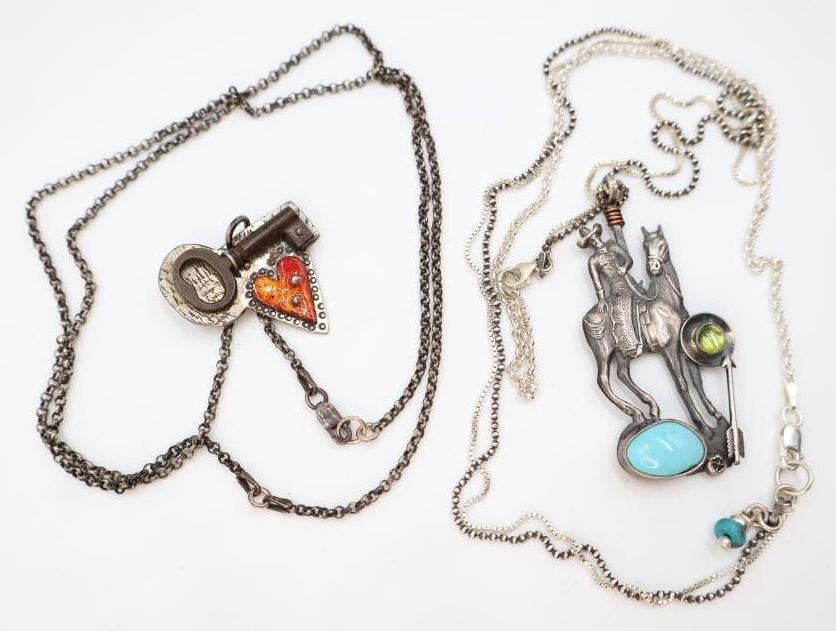 Two Sterling Silver and Mixed Media 'Worn' Necklaces: Marked Worn .925 on the back of each necklace, made by artist Chelsea Stone these sterling silver necklaces feature mixed media pieces like a brass key, enamel painted accent,s and glass/stone accents